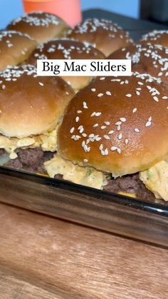 some very tasty looking hamburgers with sesame seeds on them and the words, big mac slides