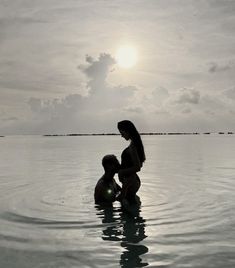 two people are in the water near each other