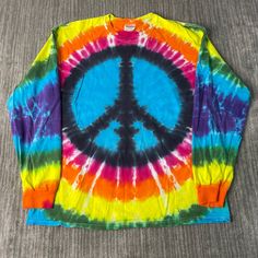 Vintage 2000s Peace Sign Tie Dye Pattern Basic Essential Streetwear Y2K Aesthetic Multi Color Long Sleeve Shirt Extra Large Mens Condition:  Fair Used Condition  = Has Holes Throughout The Shirt Due To Age And Wear  Measurements: Please see photos above for all measurements IF YOU BUY TWO OR MORE ITEMS USE THE CODE BUNDLE @ CHECK TO SAVE 20% WE SHIP WITHIN 24 HOURS AFTER PURCHASE! Please be aware that we do not offer free returns!! The Buyer is responsible for the cost of the return label. Follo Y2k Style Long Sleeve Summer Shirt, Y2k Long Sleeve Summer Shirt, Y2k Multicolor Tops For Streetwear, Tie-dye Long Sleeve Streetwear Tops, Tie Dye Long Sleeve Streetwear Top, 90s Style Long Sleeve T-shirt For Spring, 90s Long Sleeve T-shirt For Spring, Multicolor Long Sleeve Hippie Tops, Long Sleeve Graphic Print Hippie Top