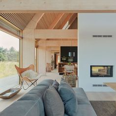 a living room filled with furniture and a fire place