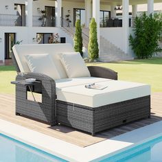 an outdoor chaise lounge next to a swimming pool