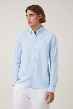 Features:  
- Long sleeve shirt - Fitted cuffs - button down collar - button PLACKET - chest pocket Light Blue Button-up Shirt With Placket, Light Blue Button-up Shirt With Pockets, Summer Light Blue Cotton Dress Shirt, Light Blue Cotton Dress Shirt For Spring, Summer Light Blue Dress Shirt With Button Closure, Light Blue Casual Shirt With Button Cuffs, Blue Cotton Dress Shirt With Relaxed Fit, Blue Cotton Dress Shirt With Pockets, Casual Light Blue Dress Shirt For Summer