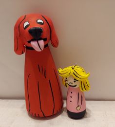 I have recreated in Peg Doll form The Iconic Childhood favorites from the story books of CLIFFORD THE BIG RED DOG. There's Great BIG CLIFFORD The DOG standing tall at a little over three and a half inches and his very best friend in the world Emily Elizabeth is one and half inches tall. I Have Hand Sculpted and Hand Painted little details to make these beloved characters unique and special.  *Please Note that these are an example of the Peg Doll Set you will receive and may differ slightly from the photos as each Peg Doll Set is hand made *ALL PEG DOLLS ARE COATED IN A NON-TOXIC WATER BASED POLYURETHANE COATING TO PROTECT EACH ONE.  ❤️ Best Friend In The World, Clifford The Big Red Dog, Emily Elizabeth, Dog Standing, Heirloom Toys, Dog Room, Dog Rooms, Story Books, Toxic Water