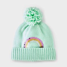 Amp up your accessories with the Girls' Cuff Beanie with Rainbow Sequins Embroidery Hat from Cat & Jack™ in Mint Green. This fashion beanie is made of midweight knit fabric with full lining for all-day cozy comfort. It features a sequenced rainbow detailing with a pom-pom accent on the top to add a cute touch to their cool-weather outfit, while the pull-on style allows for easy on and off making it a must have for your winter wardrobe. Cat & Jack™: Designed for all children so you can trust it's Green Winter Hat, Fashion Beanie, Green Beanie, Embroidery Hat, Girls Sun Hat, Hat Embroidery, Recycled Polyester Fabric, Girls Fleece, Cat And Jack