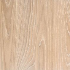 closeup of the wood grains on a wooden flooring paneled with white paint