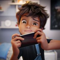 a young boy holding up a smart phone