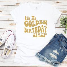 "It's time to celebrate! Introducing the \"Golden Birthday Glam\" Tee - the perfect way to shine on your special day! Crafted with celebration in mind, this dazzling shirt is more than just fabric; it's a statement of style and joy. Made from high-quality cotton, our Golden Birthday Tee feels as good as it looks. The shirt features a glimmering gold glitter vinyl design that proudly announces, \"It's my golden birthday!\" along with your age. The golden hues reflect the radiance of your mileston Golden Birthday Ideas For Women, Golden Birthday Outfit Women, Golden Birthday Gifts, Golden Bday, Birthday Glam, It's My Birthday Shirt, Champagne Birthday, Birthday Outfit For Women, Birthday Star