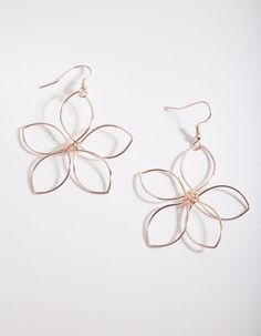 Flower power! This pair of rose gold-tone drop earrings feature a open wire flower design. Style with delicate pearl and rose gold-toned necklaces and rings for a refined and classic finish. 

Composition: Rose gold-toned
Colour: Rose gold
Style: Style with delicate pearl and rose gold-toned necklaces and rings for a refined and classic finish. 

Occasion: Dress them up or down, it's up to you!
Care: Avoid direct contact with water, moisturisers and perfumes.
Size: 6cm (L) x Fashion Jewellery Online, Open Flower, Flower Drop Earrings, Wire Flowers, Bold Earrings, Crafts For Girls, Gold Wire, Wire Earrings, Rose Earrings