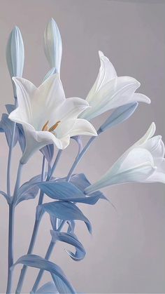 white flowers are in a blue vase on a gray tablecloth, and the background is blurry