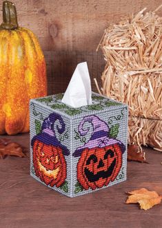 a tissue box with two pumpkins on it