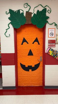 an orange door decorated to look like a pumpkin