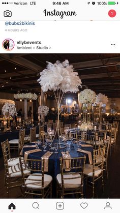 the instagram page for an event with blue and gold tables, white chairs and centerpieces