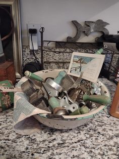 a bowl filled with assorted items on top of a counter