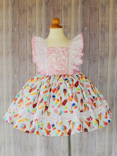 This is a beautiful Ice cream dress for your little one will look gorgeous in this dress, is perfect for a birthday ice cream party. Girls size Chest 2T 19'' 3T 21'' 4T 22'' 5T 23'' 6 24'' I use an underskirt just to show how puffy is the dress. if you want a puffy look you will need to buy a under skirt and it sold separately. Any question please don't hesitate in contact me. Please leave me a note with the following instructions. *Size Cream Birthday Dress For Spring, Cream Spring Birthday Dress, Cream Dress For Spring Birthday, Sweet Cream Party Dress, Cute Cream Dress For First Birthday, Whimsical Summer Dress For First Birthday, Cream Ruffled Dress For Cake Smash, Fun Summer Dress For First Birthday, Cream Ruffled Dress For First Birthday