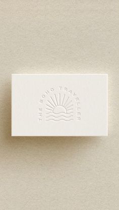 a white business card sitting on top of a table