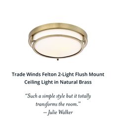 a light that is on top of a white wall with a quote about lighting in natural brass