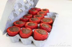 chocolate covered strawberries in an egg carton