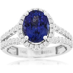 Royal 14K White Gold Split Shank Halo Ring with 2.00 Carat Oval Tanzanite and 0.72 Carat Diamond Accents Tanzanite And Diamond Ring, Tanzanite Diamond Ring, Halo Setting, Royal Jewelry, Split Shank, Halo Ring, Sparkle Diamonds, Rarity, Timeless Beauty