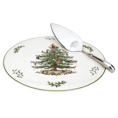 a plate with a christmas tree on it and a spatula next to the plate