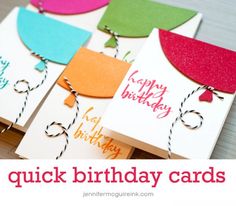 three birthday cards with tags attached to them