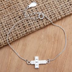 Shining brightly, this cross bracelet is a beautiful way to express your Christian faith. Asmara Putra in Bali designs the pendant bracelet, which is crafted from sterling silver. Sterling Silver Spiritual Rosary Bracelet With Cross, Sterling Silver Cross Rosary Bracelet, Spiritual Sterling Silver Cross Rosary Bracelet, Silver Cross Bracelet, Spiritual Style, Silver Bracelet With Cross Pendant As Gift, Silver Cross Rosary Bracelet, Spiritual Silver Cross Bracelet, Adjustable Silver Cross Rosary Bracelet, Amethyst Cocktail Ring