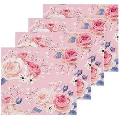 four pink floral placemats with white flowers on them