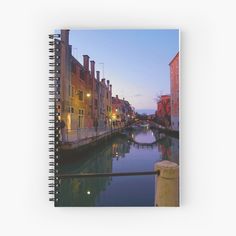 a canal in the city at night spiral notebook