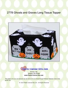 a black tissue box with ghost and pumpkins on it, in front of white polka dots