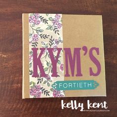 a card with the words kym's written in purple and pink on it