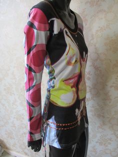 "Vintage Desigual tee-shirt. Long sleeves and a round neck.  This top has lots of different colours and patterns and a tie at the hip. Bust ;  34\" Length ;  27\" Sleeve;  20\"   Made by DESIGUAL cotton" Fitted Multicolor Fashion Print Tops, Multicolor Fashion Print Top For Fall, Artistic Multicolor Print Tops For Spring, Spring Artistic Multicolor Print Tops, Long Sleeve Graphic Print Hippie Top, Fitted Fashion Print T-shirt For Summer, Multicolor Abstract Print T-shirt For Spring, Fitted Patterned Tops With Graphic Print, Fitted Graphic Print T-shirt For Festival