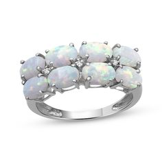 Impress and intrigue with this elegant lab-created opal ring. Sterling silver Oval-cut lab-created opal cabochons line up horizontally across two rows A white lab-created sapphire twinkles between each duo Opal is the traditional birthstone of October White Lab, Opal White, Opal Ring, October Birth Stone, Ring Sterling Silver, Opal Rings, Oval Cut, Birthstone, The Row