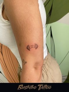 a woman with a small tattoo on her arm