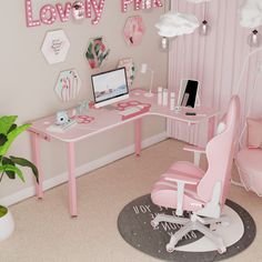 a pink desk with a laptop on it in a girls's room decorated for valentine's day