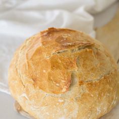 a loaf of bread sitting on top of a cutting board