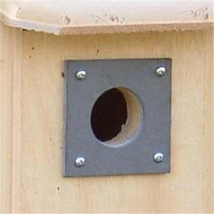 a bird house with a hole in the middle