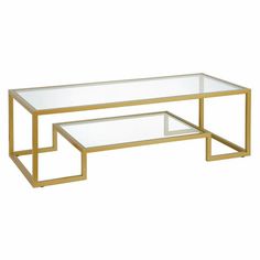 a glass and gold coffee table with two tables on each side, one in the middle