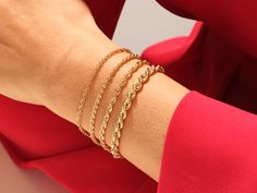 Give your personal style an extra zing with this bold, statement-making bracelet. A luxurious and timeless addition to any bracelet collection, its rich color and sleek design makes it a worthy investment. • Material: 14k Solid Gold (Stamped 14K for authenticity) • Color Options: Yellow Gold • Chain Style: Rope Chain • Chain Width: 4.50 mm • Clasp Type: lobster clasp • Available Lengths: 5", 5.5", 6", 6.5", 7", 7.5", 8" For custom lengths feel free to contact us. We can make this bracelet in any Luxury Stackable Chain Bracelet For Formal Occasions, Luxury Formal Stackable Chain Bracelet, Bracelet Size Chart, Gold Rope Chains, Layered Bracelets, Yellow Gold Chain, Bracelet Collection, Colorful Bracelets, Rope Chain