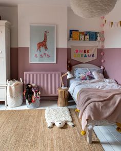 a child's bedroom with pink and white walls