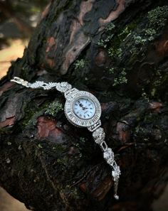 Womens Circle Iced Wrist Watch 925 Sterling Silver, Handmade Shiny Zircon Gems Watch For Woman, 925K Female Watch, Unique Gift For Her ▶ Only 1 Available For This Style. This 925 Sterling Silver Iced Out Watch For Women is Rhodium plated on 925 Sterling Silver. That's why it never tarnishes. Product; Except for the round case back of the watch (Stainless Steel), it is made of 925 sterling silver and is crafted with hundreds of zircon stones.◀ ✦Item Details Everything about the watch except its m Wedding Jewelry And Watches With 17 Jewels Round Dial, Luxury Hallmarked Diamond Watch For Weddings, White Gold Wedding Watches With Jubilee Bracelet, White Gold Watches With Jubilee Bracelet For Weddings, Luxury Silver Jewelry And Watches With 17 Jewels, Silver Diamond Watch With Bracelet Strap As Gift, White Gold Wedding Jewelry With Round Dial, Luxury Silver Diamond Watch For Wedding, White Gold Cubic Zirconia Watch For Gift