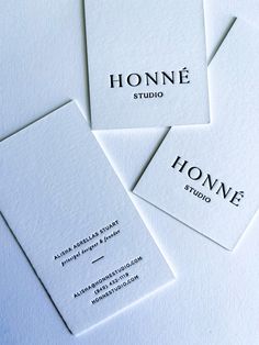 four business cards with the name honne studio written on them, all in black and white