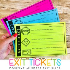 someone is holding up some ticket cards to show off their exit tickets for the event