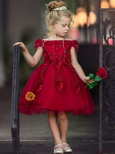 She will be the talk of this year's family holiday card! This gorgeous dark red dress has an off-shoulder silhouette. Its also covered with flower appliques, and the tulle skirt is perfect for twirling in.  Buttery-soft with no bunching, itching, or stuffiness Keeps its cuteness wear after wear  Perfect for birthdays, communion, pageants, weddings, and special occasions Off-shoulder princess dress with fall floral embroidered bodice and gathered tulle skirt Dress available in sizes 12MON, 2T-12Y Family Holiday Card, Red Flower Girl, Red Flower Girl Dresses, Tulle Skirt Dress, Dark Red Dresses, Dressy Shoes, Special Occasion Dress, Dressy Dresses, Flower Applique