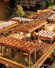 a table filled with lots of different types of desserts