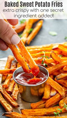 baked sweet potato fries being dipped with ketchup