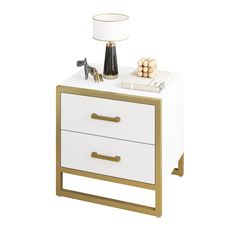 a nightstand with two drawers and a lamp on top