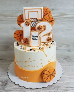 a birthday cake decorated with basketballs and numbers