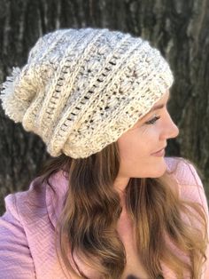 a woman wearing a white knitted hat