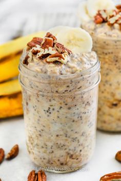 two small jars filled with oatmeal and nuts next to banana peels