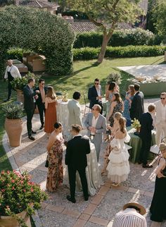 a group of people standing around each other