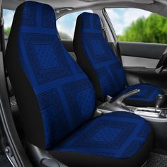 the interior of a car with blue seat covers